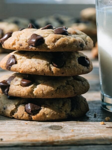 Grandma Ricke's Cookie Recipe recipe hero presentation - Stunning photorealistic hero shot of freshly baked Grandma Ricke's Cookies resting on a rustic woode