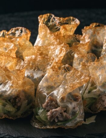 What is the best filling for rice paper dumplings? recipe hero presentation - Stunning photorealistic hero shot of crispy golden rice paper dumplings filled with savory pork and