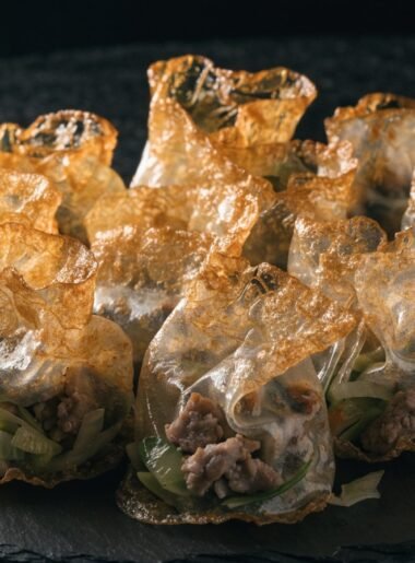 What is the best filling for rice paper dumplings? recipe hero presentation - Stunning photorealistic hero shot of crispy golden rice paper dumplings filled with savory pork and