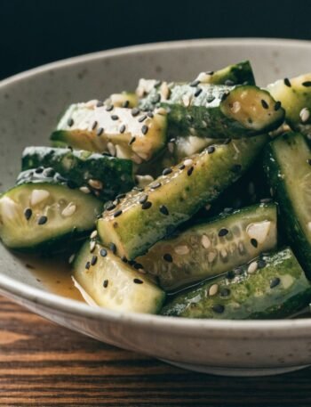 Why do you smash cucumbers in a salad? recipe hero presentation - Stunning photorealistic hero shot of Why do you smash cucumbers in a salad?, featuring bruised crunc