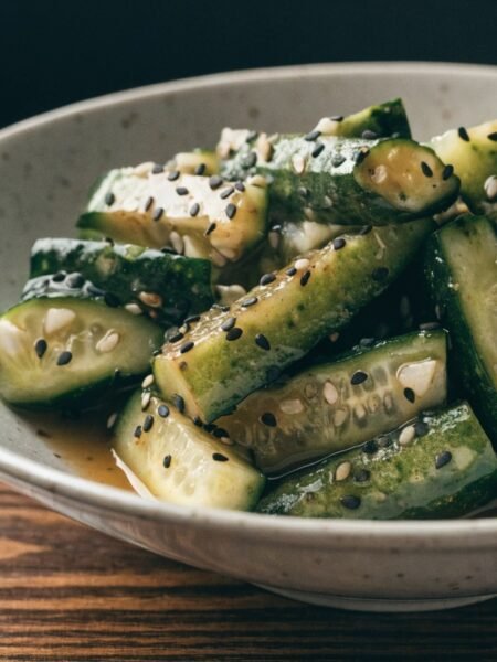Why do you smash cucumbers in a salad? recipe hero presentation - Stunning photorealistic hero shot of Why do you smash cucumbers in a salad?, featuring bruised crunc